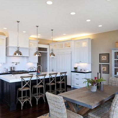 Large elegant l-shaped dark wood floor eat-in kitchen photo in Salt Lake City with shaker cabinets, subway tile backsplash, an undermount sink, white cabinets, marble countertops, white backsplash, stainless steel appliances and an island