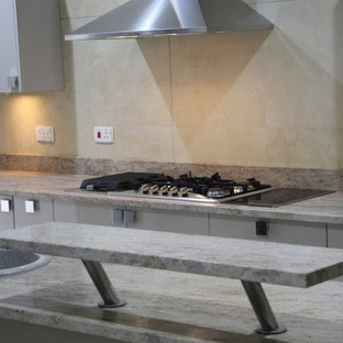 Design ideas for a mid-sized contemporary u-shaped separate kitchen in Other with a double-bowl sink, flat-panel cabinets, grey cabinets, granite benchtops, yellow splashback, marble splashback, stainless steel appliances, marble floors, a peninsula, yellow floor and yellow benchtop.