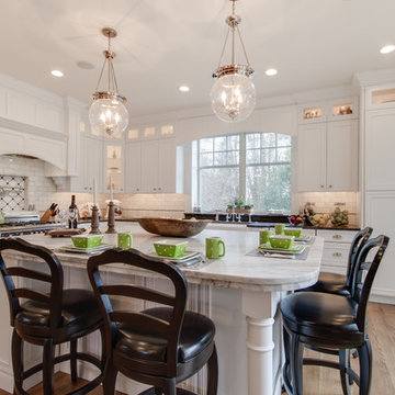Mont Blanc Quartzite & Silver Pearl Granite in a White Kitchen