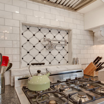 Mont Blanc Quartzite & Silver Pearl Granite in a White Kitchen