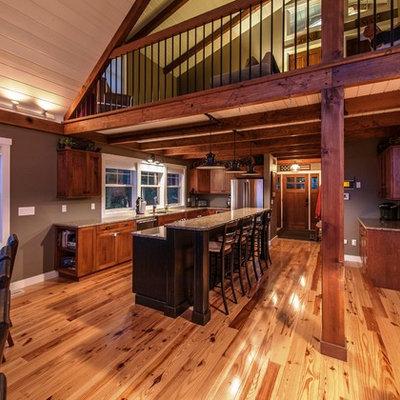 Large mountain style l-shaped light wood floor eat-in kitchen photo in Portland Maine with an undermount sink, flat-panel cabinets, medium tone wood cabinets, granite countertops, stainless steel appliances and an island