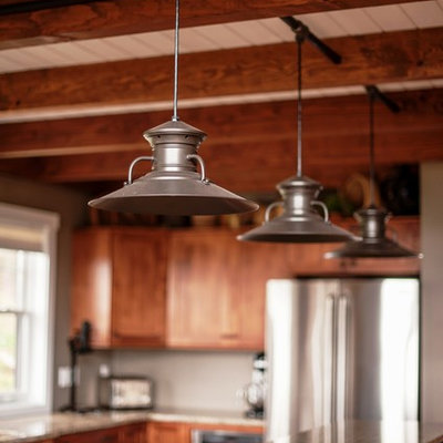 Large mountain style l-shaped light wood floor eat-in kitchen photo in Portland Maine with an undermount sink, flat-panel cabinets, medium tone wood cabinets, granite countertops, stainless steel appliances and an island
