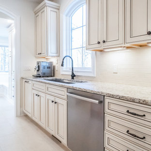 Large french country eat-in kitchen remodeling - Eat-in kitchen - large french country beige floor eat-in kitchen idea in Cleveland with a double-bowl sink, beige cabinets, beige backsplash, stainless steel appliances and multicolored countertops