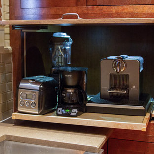 Mid-sized craftsman open concept kitchen designs - Open concept kitchen - mid-sized craftsman u-shaped light wood floor open concept kitchen idea in New Orleans with a farmhouse sink, shaker cabinets, quartz countertops, beige backsplash, glass tile backsplash, stainless steel appliances and an island