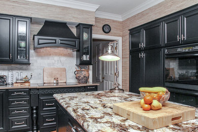 Example of a mid-sized transitional u-shaped eat-in kitchen design in Atlanta with recessed-panel cabinets, black cabinets and an island