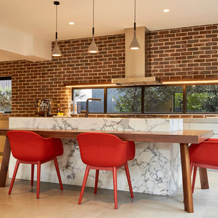 Inspiration for a contemporary kitchen in Sydney with flat-panel cabinets, grey cabinets, with island, beige floor and grey benchtop.