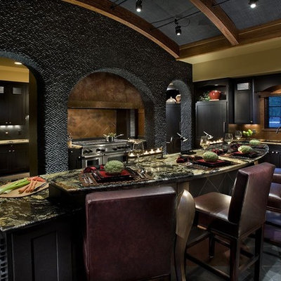 Enclosed kitchen - large contemporary u-shaped ceramic tile enclosed kitchen idea in Phoenix with shaker cabinets, black cabinets, granite countertops, brown backsplash, ceramic backsplash, stainless steel appliances and an island