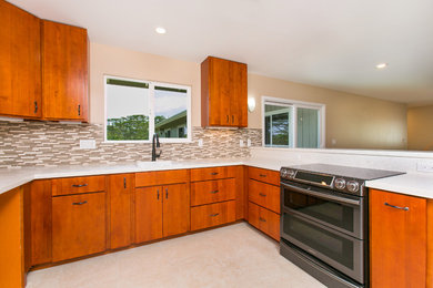 Example of a mid-sized transitional u-shaped ceramic tile and beige floor open concept kitchen design in Hawaii with an undermount sink, flat-panel cabinets, medium tone wood cabinets, brown backsplash, matchstick tile backsplash, stainless steel appliances and a peninsula