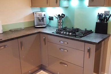 This is an example of a modern kitchen in Manchester.