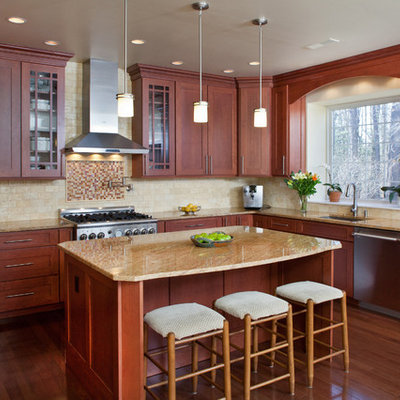 Kitchen - traditional kitchen idea in Philadelphia with shaker cabinets, medium tone wood cabinets, beige backsplash and stainless steel appliances