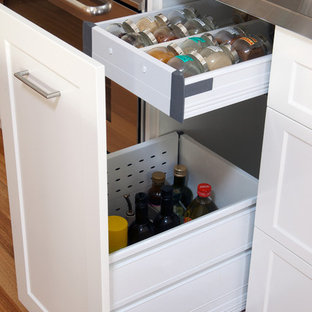 Modern kitchen photos - Inspiration for a modern medium tone wood floor kitchen remodel in Perth with recessed-panel cabinets, white cabinets and stainless steel countertops