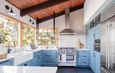 A Kitchen With Unexpected Blue Cabinets, Nice Storage and Views