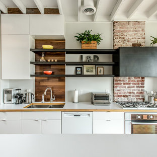 This is an example of a contemporary kitchen in Richmond with a double-bowl sink, flat-panel cabinets, white cabinets and white appliances.