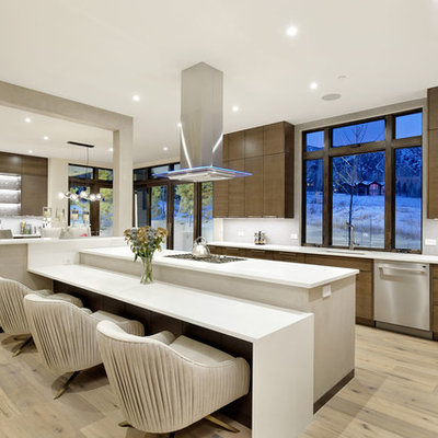 Inspiration for a large contemporary u-shaped light wood floor and beige floor eat-in kitchen remodel in Denver with flat-panel cabinets, dark wood cabinets, an undermount sink, window backsplash, stainless steel appliances, quartzite countertops, gray backsplash, an island and white countertops