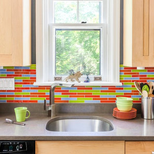 Inspiration for a small eclectic galley separate kitchen in Philadelphia with an undermount sink, shaker cabinets, light wood cabinets, quartz benchtops, multi-coloured splashback, glass tile splashback, stainless steel appliances, ceramic floors and no island.