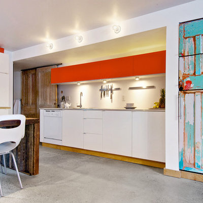 Trendy kitchen photo in Toronto with concrete countertops and white appliances