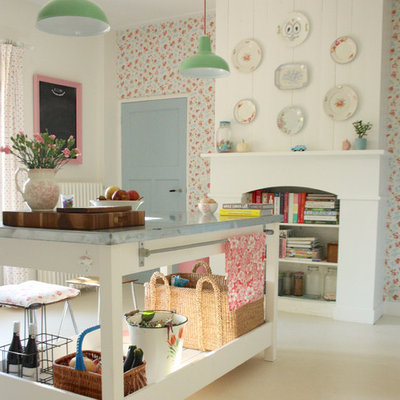 Cottage chic kitchen photo in Amsterdam with white cabinets and zinc countertops