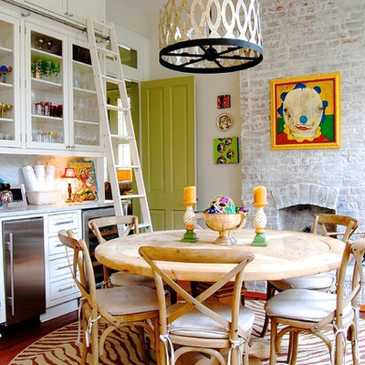 Eat-in kitchen - eclectic eat-in kitchen idea in New York with glass-front cabinets