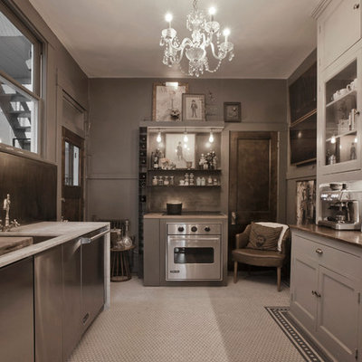 Enclosed kitchen - contemporary u-shaped enclosed kitchen idea in Salt Lake City with an undermount sink, recessed-panel cabinets, gray cabinets and stainless steel appliances