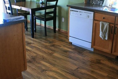 Kitchen - mid-sized traditional medium tone wood floor kitchen idea in Seattle with shaker cabinets and medium tone wood cabinets
