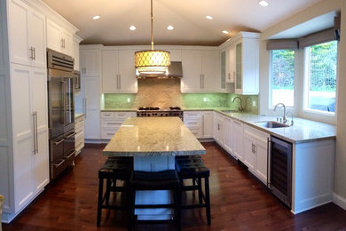 Example of a transitional kitchen design in Los Angeles with an island