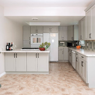 Inspiration for a small traditional l-shaped eat-in kitchen in Los Angeles with a drop-in sink, shaker cabinets, grey cabinets, quartz benchtops, blue splashback, cement tile splashback, white appliances, ceramic floors, no island and pink floor.
