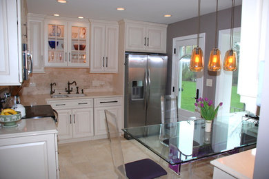 Example of a mid-sized eclectic l-shaped beige floor eat-in kitchen design in Chicago with raised-panel cabinets, beige cabinets, quartz countertops, beige backsplash, stone tile backsplash, stainless steel appliances and no island