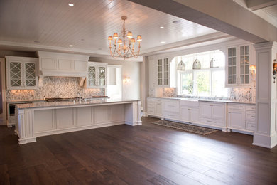 Inspiration for a huge farmhouse u-shaped dark wood floor open concept kitchen remodel in Milwaukee with shaker cabinets, white cabinets, an island, marble countertops, multicolored backsplash, mosaic tile backsplash, stainless steel appliances and a farmhouse sink