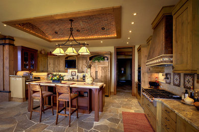 Large mountain style u-shaped open concept kitchen photo in Other with shaker cabinets, light wood cabinets, beige backsplash, subway tile backsplash, paneled appliances, granite countertops and an island