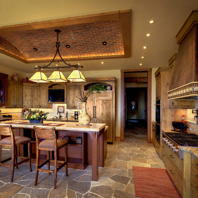 Large mountain style u-shaped open concept kitchen photo in Other with shaker cabinets, light wood cabinets, beige backsplash, subway tile backsplash, paneled appliances, granite countertops and an island