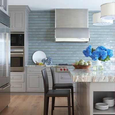 Inspiration for a coastal kitchen remodel in Boston with raised-panel cabinets, gray cabinets, marble countertops, blue backsplash and stainless steel appliances