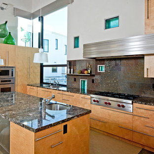 Design ideas for an industrial kitchen in San Francisco with stainless steel appliances and slate splashback.