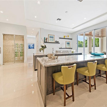 Naples Florida White Kitchen with Gray Island and White Bathroom Cabinets
