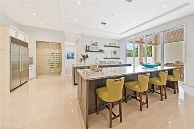 Naples Florida White Kitchen with Gray Island and White Bathroom Cabinets