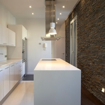 Narrow kitchen space with contrasting materials