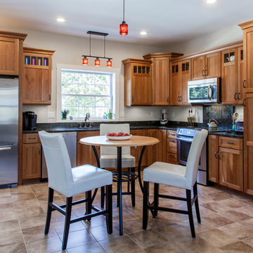 Natural Cherry Shaker kitchen with dark granite countertops