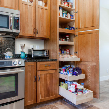 Natural Cherry Shaker kitchen with dark granite countertops