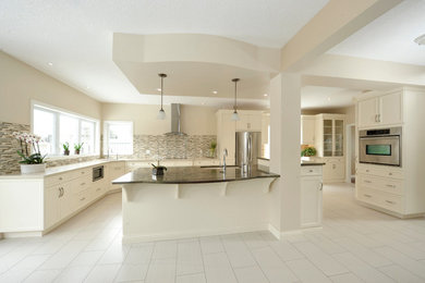 Example of a large transitional porcelain tile kitchen design in Toronto with a double-bowl sink, shaker cabinets, white cabinets, granite countertops, multicolored backsplash, matchstick tile backsplash, stainless steel appliances and an island