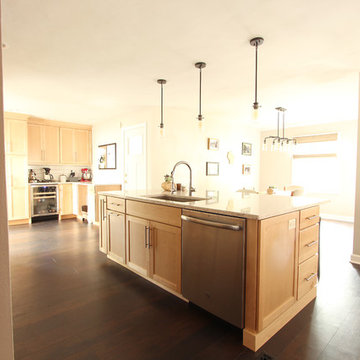 Natural Maple Cabinets in Open Kitchen with Quartz Countertops