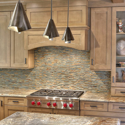 Large eclectic l-shaped ceramic tile eat-in kitchen photo in San Francisco with an undermount sink, shaker cabinets, brown cabinets, granite countertops, multicolored backsplash, stone tile backsplash, stainless steel appliances and an island