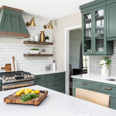 Enclosed kitchen - mid-sized transitional u-shaped light wood floor enclosed kitchen idea in Chicago with an undermount sink, shaker cabinets, green cabinets, quartz countertops, white backsplash, cement tile backsplash, stainless steel appliances, an island and white countertops