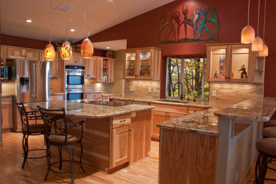 Example of a southwest eat-in kitchen design in Other with an island