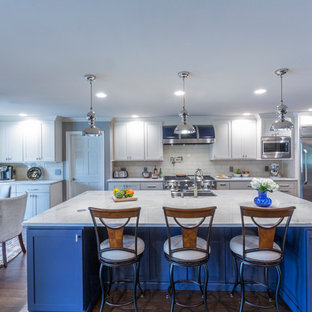 Mid-sized transitional eat-in kitchen designs - Eat-in kitchen - mid-sized transitional single-wall dark wood floor and brown floor eat-in kitchen idea in Dallas with an undermount sink, shaker cabinets, white cabinets, marble countertops, white backsplash, subway tile backsplash, stainless steel appliances and an island
