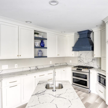 Navy Stained Island, Hood vent and Floating Shelves in White Shaker Kitchen