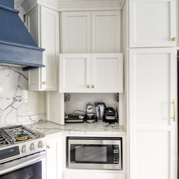 https://www.houzz.com/hznb/photos/navy-stained-island-hood-vent-and-floating-shelves-in-white-shaker-kitchen-transitional-kitchen-dc-metro-phvw-vp~149442603