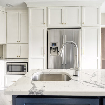 Navy Stained Island, Hood vent and Floating Shelves in White Shaker Kitchen