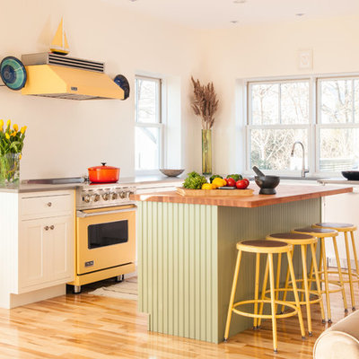 Inspiration for an eclectic l-shaped open concept kitchen remodel in Boston with shaker cabinets, white cabinets and colored appliances