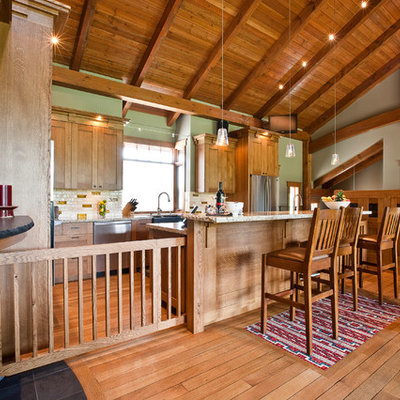Arts and crafts kitchen photo in Calgary with a farmhouse sink, medium tone wood cabinets, granite countertops, multicolored backsplash and stainless steel appliances