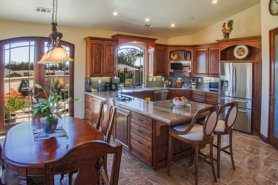Nester customized D Plan - warm and inviting kitchen, dining and courtyard