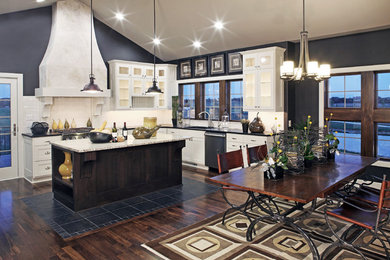 Example of a mid-sized trendy l-shaped dark wood floor and brown floor eat-in kitchen design in Omaha with an undermount sink, white cabinets, granite countertops, white backsplash, stainless steel appliances, an island, recessed-panel cabinets and subway tile backsplash